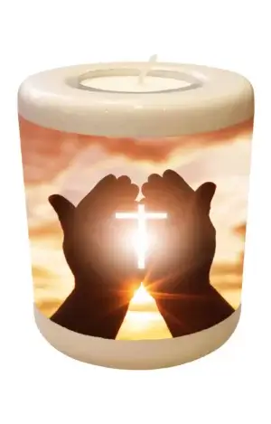 Memorial light with cross in hands
