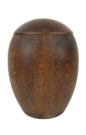 Oak woodn urn covered with dark oil round modern shape